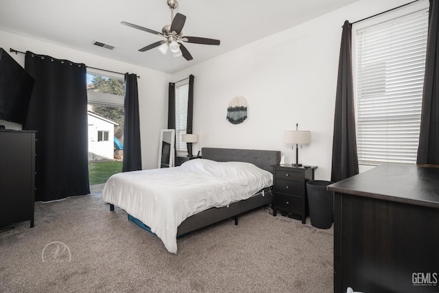 bedroom featuring carpet, access to outside, and ceiling fan