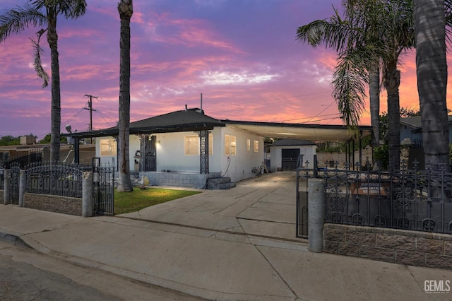 2110 Center St, Bakersfield, CA 93305 - manufactured / mobile home with concrete driveway, an attached carport, a fenced front yard, and a shed