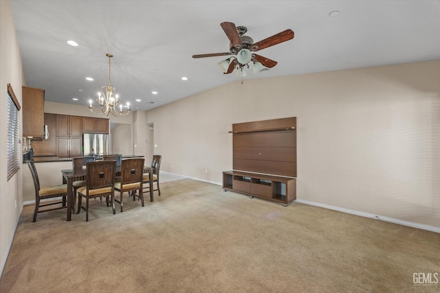 dining space with lofted ceiling, recessed lighting, light carpet, ceiling fan with notable chandelier, and baseboards