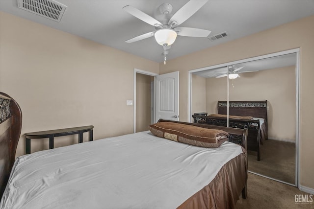 carpeted bedroom featuring ceiling fan, a closet, visible vents, and baseboards