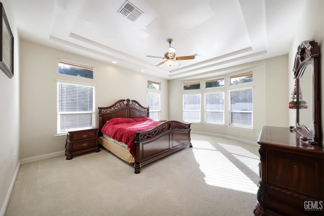 1705 Briercliff Ct, Bakersfield, CA 93311 - bedroom with a raised ceiling, multiple windows, light carpet, and baseboards