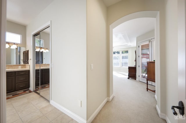 1705 Briercliff Ct, Bakersfield, CA 93311 - hall with healthy amount of natural light, arched walkways, and baseboards