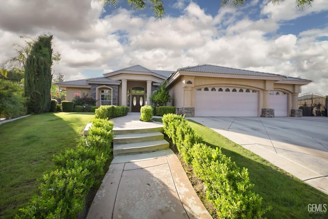 1705 Briercliff Ct, Bakersfield, CA 93311 - mediterranean / spanish house featuring stone siding, an attached garage, stucco siding, driveway, and a front lawn