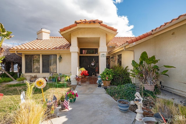 doorway to property featuring a patio