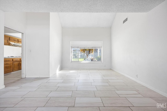 empty room with a textured ceiling