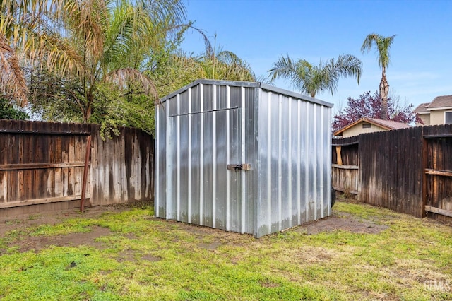 view of shed featuring a fenced backyard