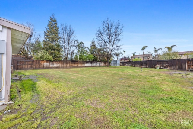 view of yard featuring a fenced backyard