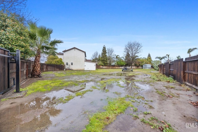 view of yard with a fenced backyard