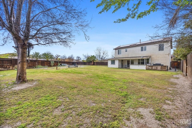 view of yard featuring a fenced backyard