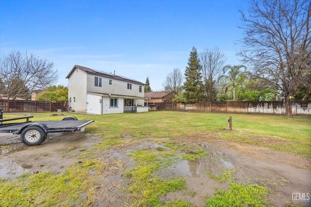 view of yard featuring a fenced backyard