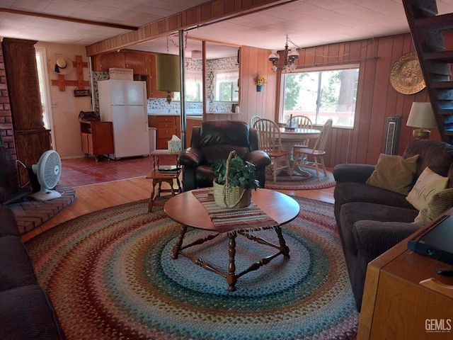 45904 Carlin Dr, Posey, CA 93260 - living area featuring wood finished floors, wood walls, and a chandelier