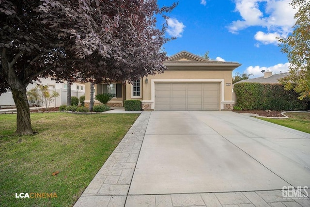 view of front of home with a garage and a front lawn