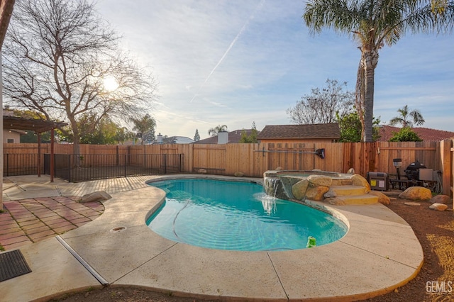 view of pool with a patio area, a fenced in pool, a hot tub, and a fenced backyard