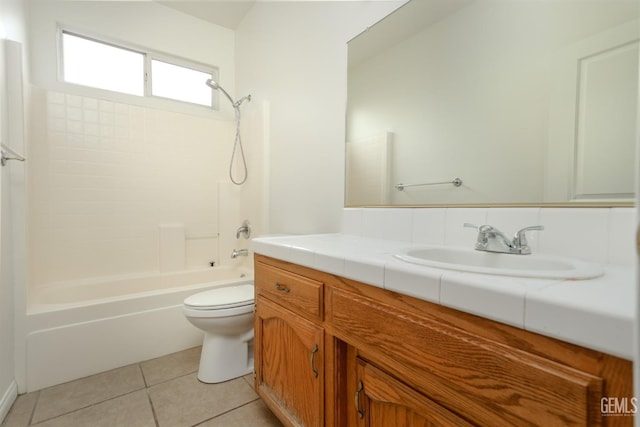 bathroom featuring vanity, tile patterned floors, toilet, and shower / washtub combination