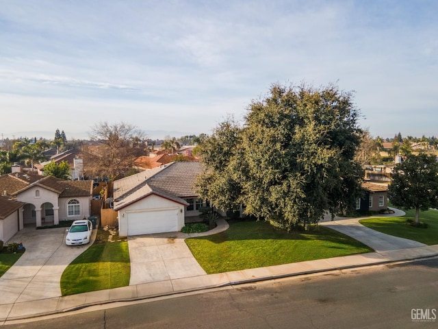 view of front of house with stucco siding, driveway, a front yard, a garage, and a tiled roof