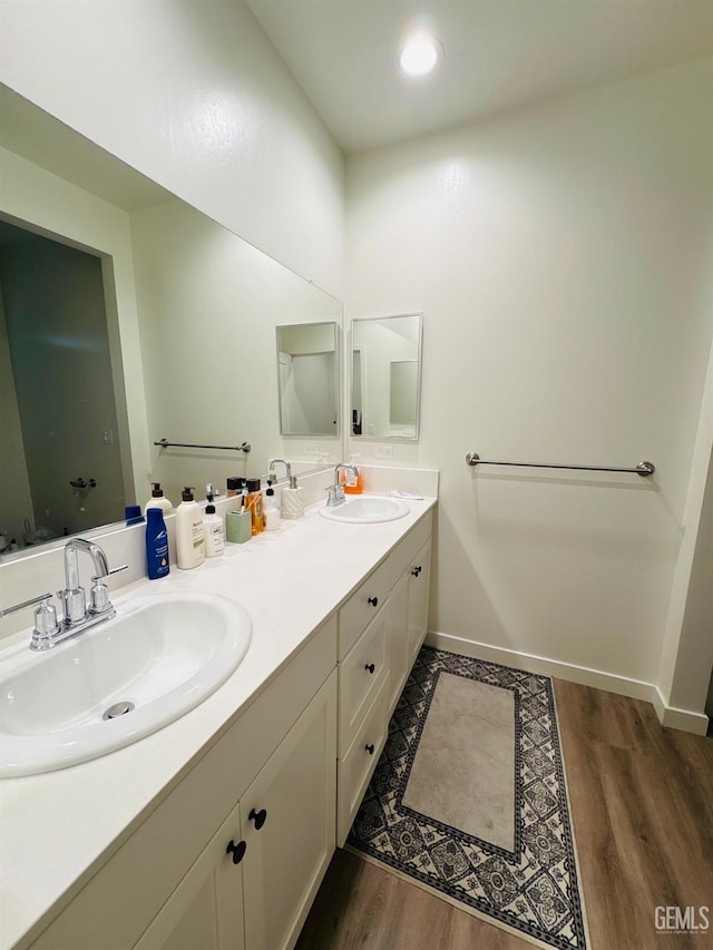 8410 Avon St, Bakersfield, CA 93314 - bathroom featuring double vanity and wood finished floors
