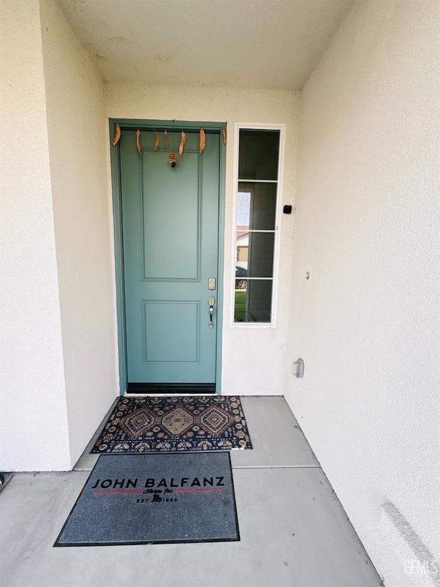 8410 Avon St, Bakersfield, CA 93314 - doorway to property featuring stucco siding