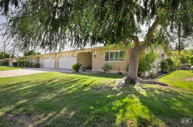 view of front of property featuring a garage, driveway, board and batten siding, and a front lawn