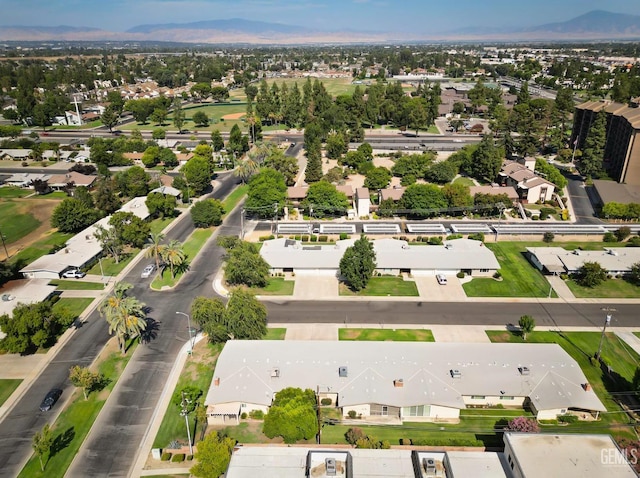 birds eye view of property with a mountain view and a residential view