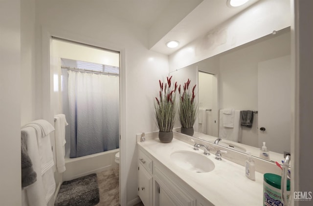 full bathroom with vanity, toilet, and shower / tub combo with curtain