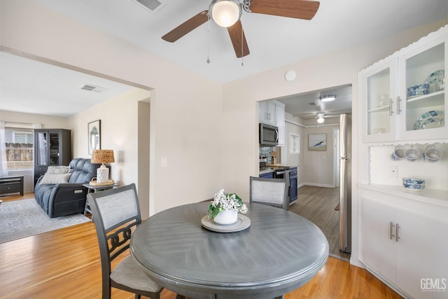 2702 Worthington Ave, Bakersfield, CA 93308 - dining area with ceiling fan and light wood-style flooring
