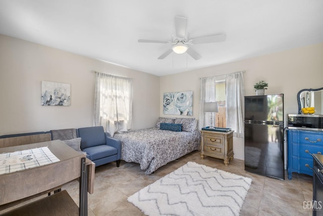 2702 Worthington Ave, Bakersfield, CA 93308 - bedroom featuring multiple windows, freestanding refrigerator, light tile patterned floors, and ceiling fan