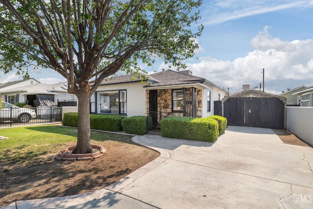 2702 Worthington Ave, Bakersfield, CA 93308 - view of front of property featuring stucco siding, stone siding, and a gate
