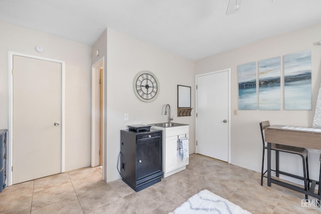 2702 Worthington Ave, Bakersfield, CA 93308 - kitchen featuring white cabinetry and light tile patterned floors