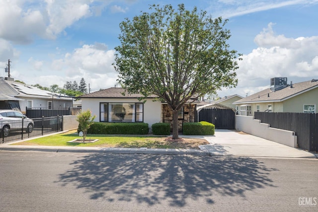 2702 Worthington Ave, Bakersfield, CA 93308 - bungalow-style home with a gate, stucco siding, and concrete driveway