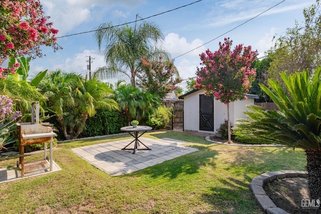 2702 Worthington Ave, Bakersfield, CA 93308 - fenced backyard featuring a patio area and a storage shed