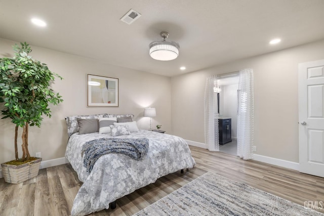 2702 Worthington Ave, Bakersfield, CA 93308 - bedroom with wood finished floors and recessed lighting