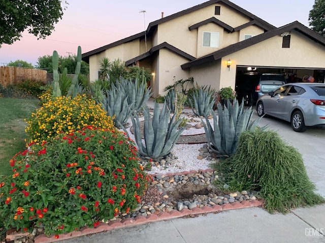 property exterior at dusk with a garage