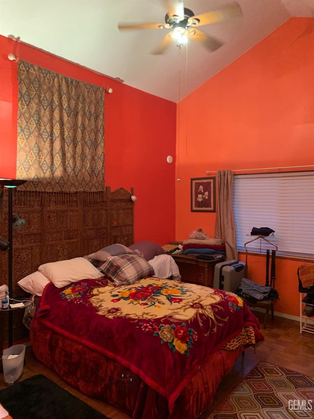 bedroom featuring ceiling fan and lofted ceiling