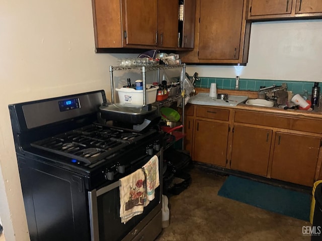 kitchen featuring sink and stainless steel gas range oven