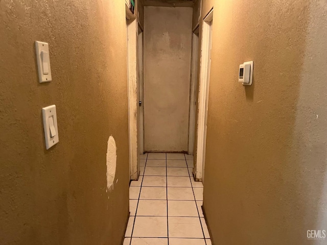 hallway with light tile patterned flooring