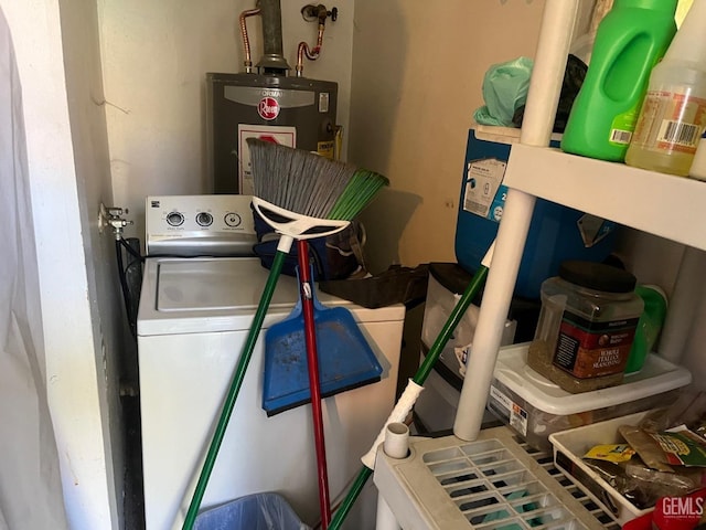 clothes washing area featuring gas water heater and washer / clothes dryer