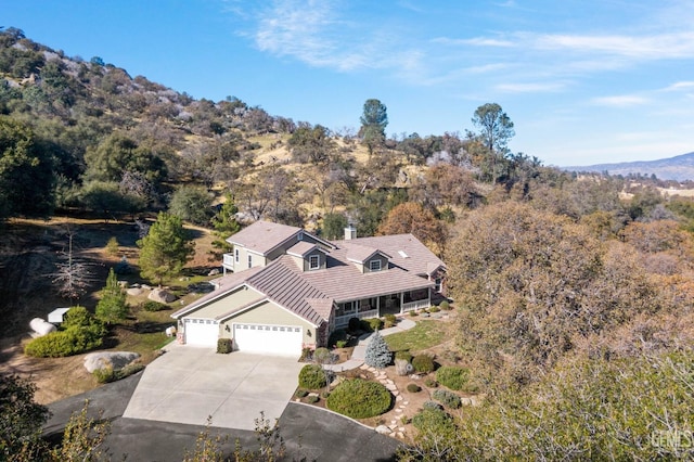 birds eye view of property with a mountain view