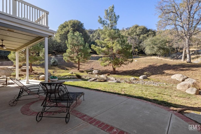 view of patio / terrace featuring a balcony and ceiling fan