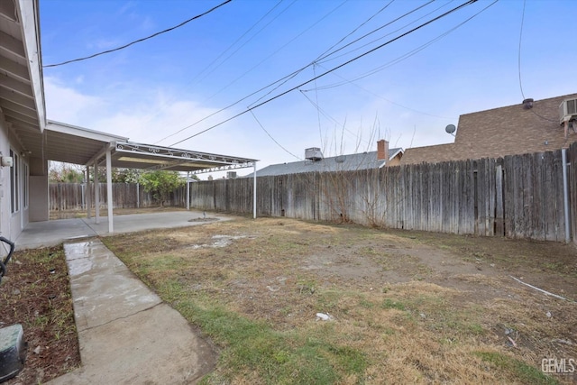 view of yard with a fenced backyard and a patio