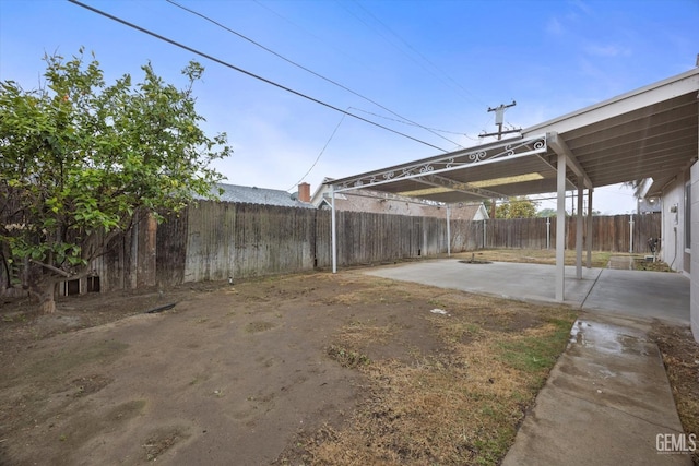 view of yard with a patio area and a fenced backyard