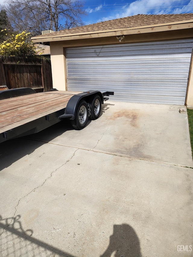 detached garage with fence