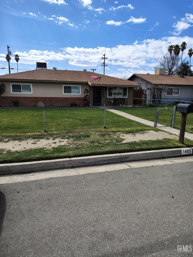 single story home with brick siding, a fenced front yard, a gate, and a front yard