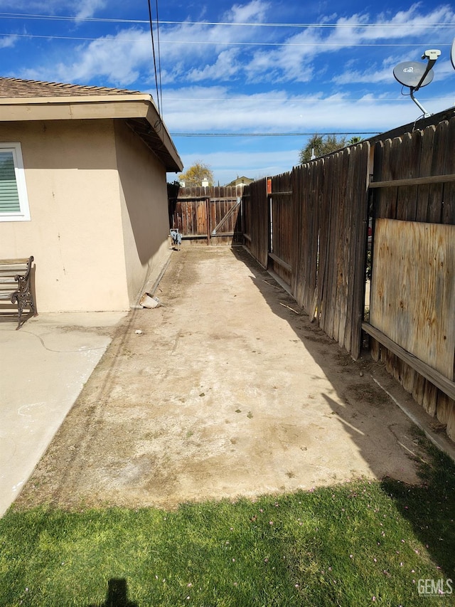 view of yard with fence private yard and a patio area