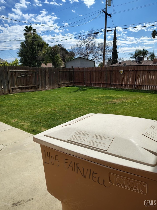 view of yard with a patio and a fenced backyard