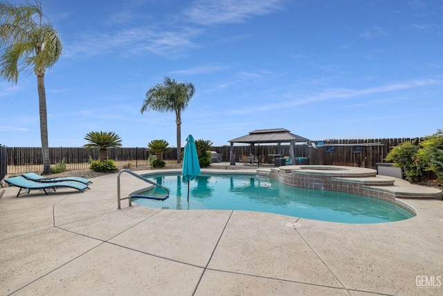 view of swimming pool featuring an in ground hot tub, a patio area, and a gazebo