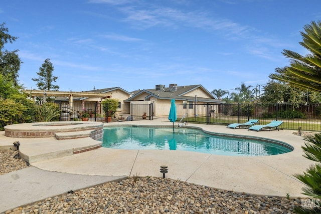 view of pool featuring an in ground hot tub and a patio area