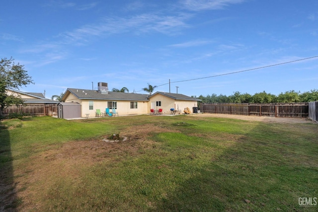 back of house with a yard