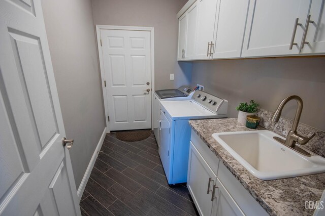 1850 Verdugo Ln, Bakersfield, CA 93312 - laundry room with washer and dryer, cabinet space, and wood finish floors