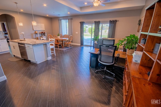 1850 Verdugo Ln, Bakersfield, CA 93312 - office area with dark wood-style floors, arched walkways, ceiling fan, recessed lighting, and a raised ceiling