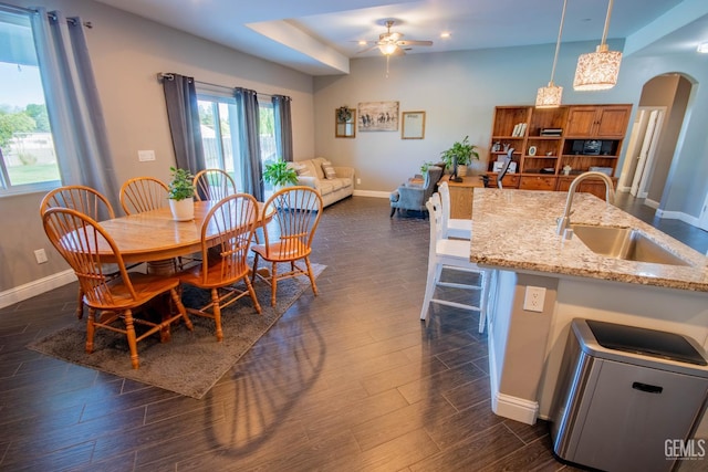 1850 Verdugo Ln, Bakersfield, CA 93312 - dining room featuring ceiling fan, arched walkways, dark wood-style flooring, and recessed lighting